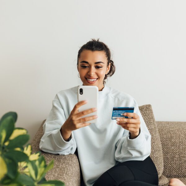 Woman doing online checkout with mobile device