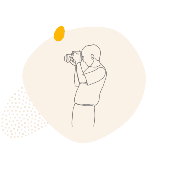 Line drawing of a photographer with a camera